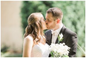 Bride and Groom kissing outside their reception venue Villa Bianca in Semour CT