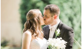 Bride and Groom kissing outside their reception venue Villa Bianca in Semour CT